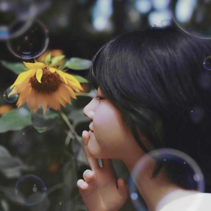 Avery Lin, Lead Design Curator at IsleForgeHarbor, reviewing corporate floral arrangements